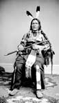 Lakota Sioux: Kah Kah Ta A Ke Ah (Flying Bird) in Native Dress Holding Pipe and Bag