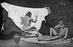 Native American Art: An Indian Artist at Work in His Lodge painting a Buffalo Robe